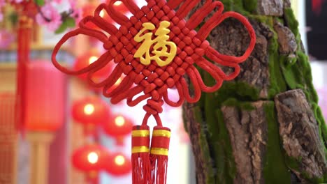 Red-hanging-at-artificial-tree-decorated